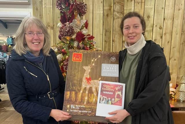 Rock Foundation CEO Pamela Hodge and Charlotte Needham collect the light up reindeer from Brigg Garden Centre