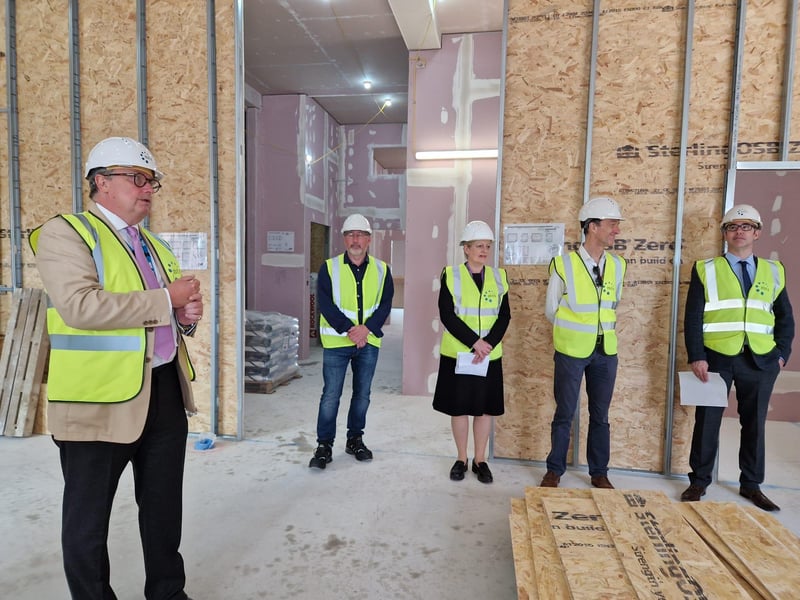 The tour begins in what will be the reception area.