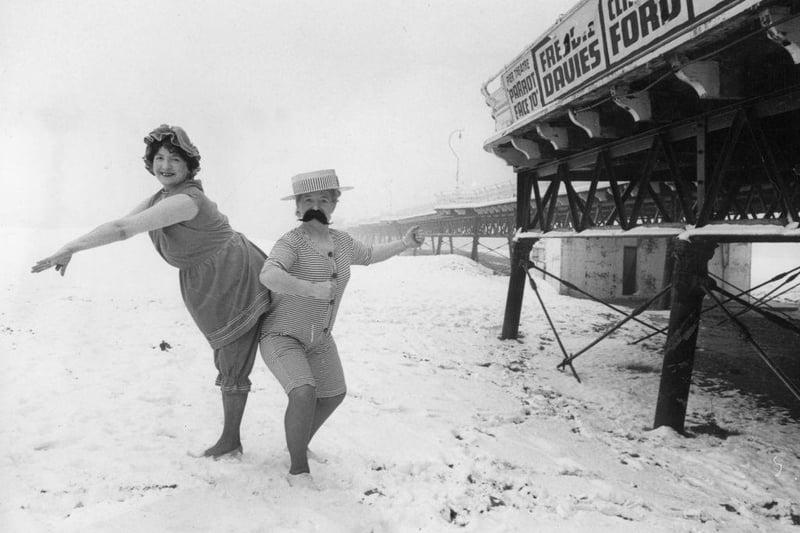 Skegness landladies Hazel Adams and Marjorie Romanis wearing 1914 bathing costumes on the beach in the snow for publicity photographs in the mid 1970's.