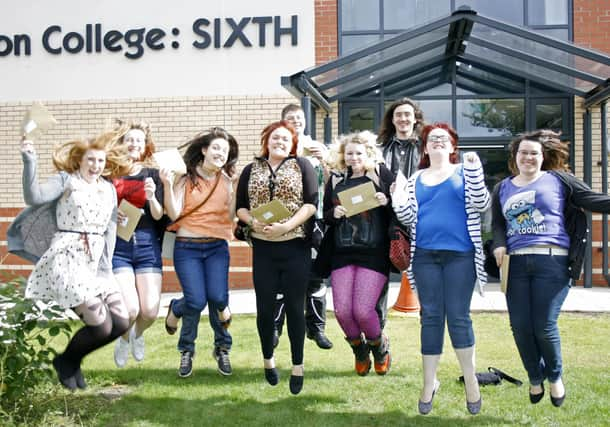 Jumping for joy - Boston College students celebrate getting their results outside the new sixth form block.