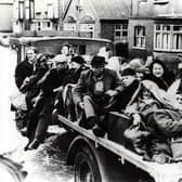 Residents fleeing the floods on a cart.