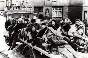 Residents fleeing the floods on a cart.
