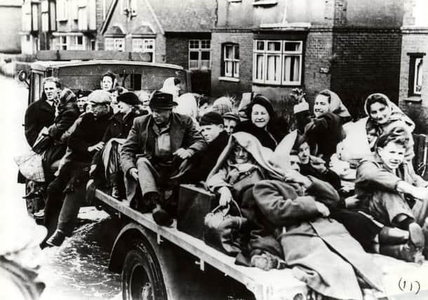 Residents fleeing the floods on a cart.
