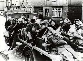 Residents fleeing the floods on a cart.