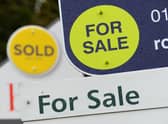 General view of estate agents signs outside a block of flats in Basingstoke, Hampshire.
