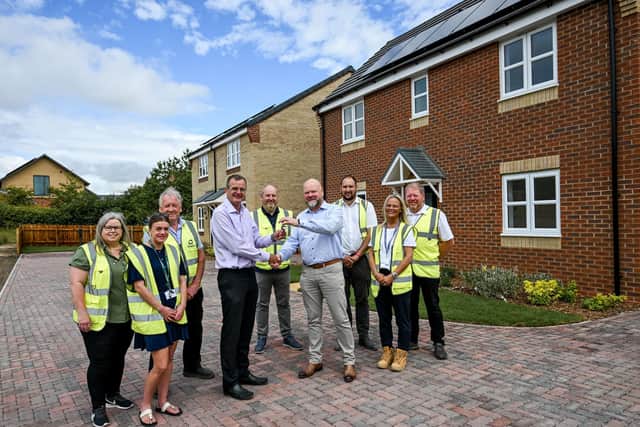 Representatives from Amplius and Allison Homes attend the handover of the final properties at The Oaks in Nettleham.