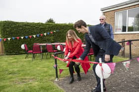 Danielle Simmonds, of Playdale and Adam Drewery of FCC cut the ribbon to unveil the play park at Billinghay.