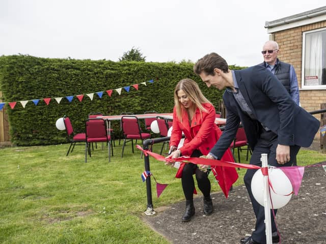 Danielle Simmonds, of Playdale and Adam Drewery of FCC cut the ribbon to unveil the play park at Billinghay.