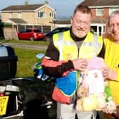 Motorcyclist Steve Milnes, left, gets the emergency teddies from Graham ‘Teddy Man’ Cadel.