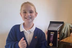 Little Trooper - aspiring young actress Isobel Johnson receives a medal from a military children’s charity.