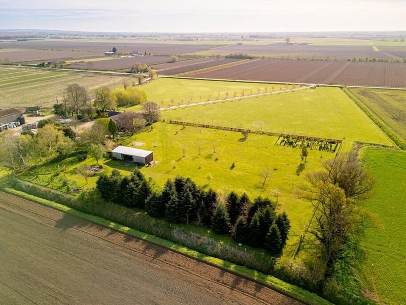 Another aerial view of the property and its grounds.