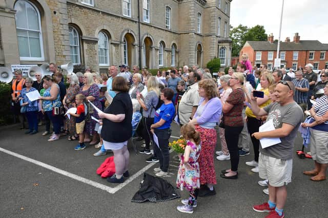 Crowds listen to the proclamation at NKDC offices on Sunday afternoon.