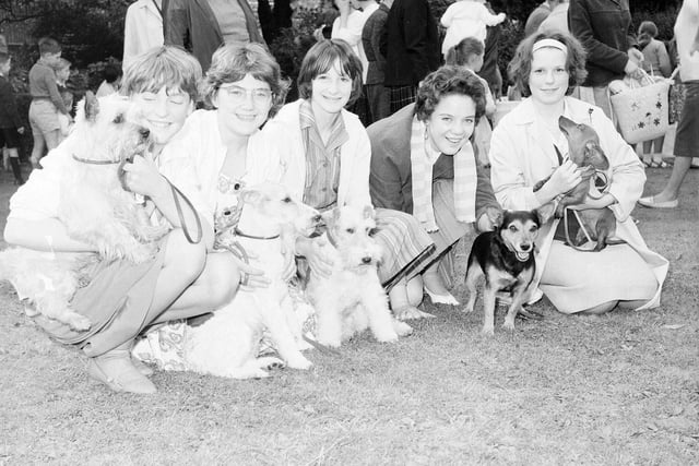 A group of girls pose with their pets at a dog show held in Heriot Row Gardens in 1963.