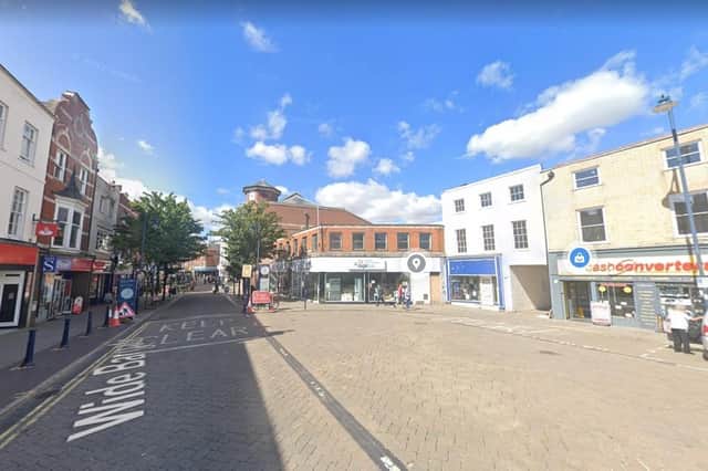 A Google streetview of the Strait Bargate/Wide Bargate area, showing Age UK and Cash Converters, and the shops with bollards placed in front of them to the left.