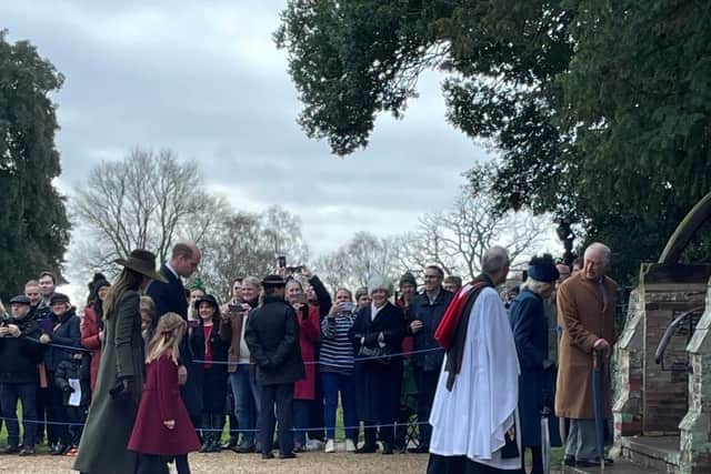 Reverend Canon Dr Paul Rhys Williams enters the church with the King and Queen Consort, with the Prince and Princess of Wales.