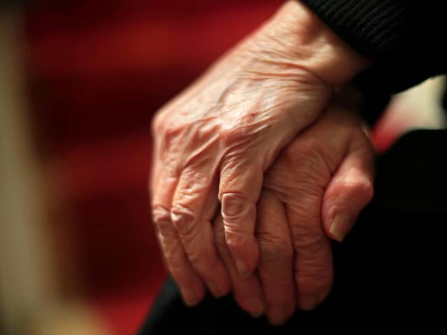 The hands of an elderly woman in Poole, Dorset. 
