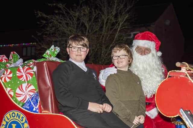 Santa and brothers Parker, 8, and Oscar Edwards, 11.