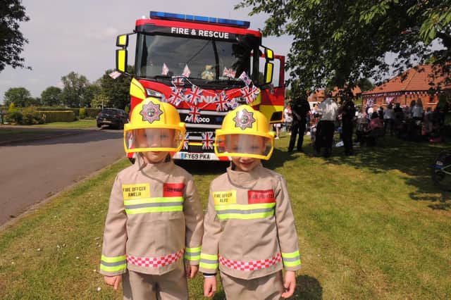 Twins Alfie and Amelia Dineen dressed as firefighters for the fancy dress contest at Brant Broughton Jubilee event.