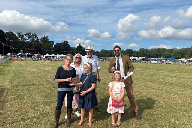 The Wiggins-Davies family presenting the garden awards.