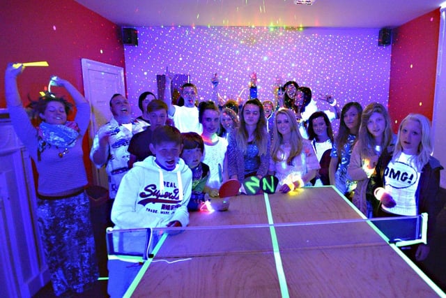 Louth's Nicohols Youth Project celebrating the opening of its new UV glow activities room by having a ping pong party with a difference.
