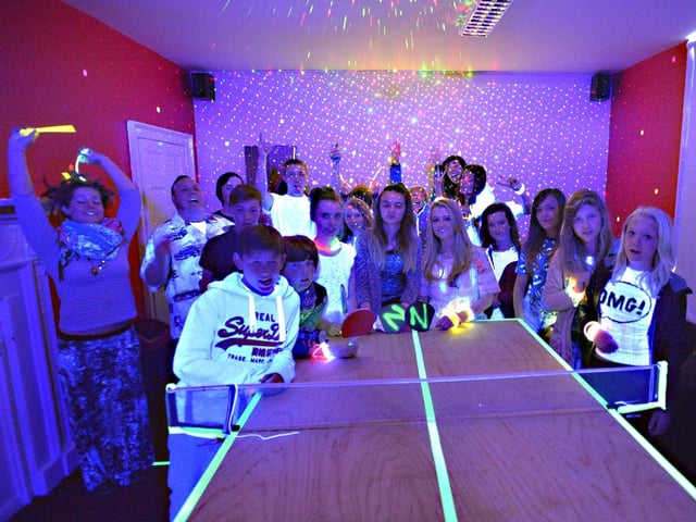 Louth's Nicohols Youth Project celebrating the opening of its new UV glow activities room by having a ping pong party with a difference.
