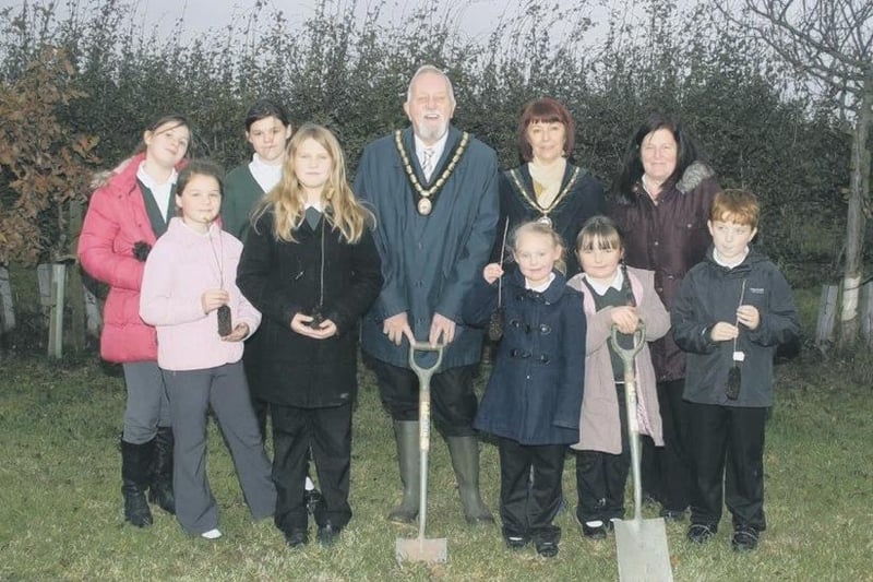 Pupils from Seathorne Primary School with deputy mayor and mayoress George and Julie Saxon planting trees in St Mary’s Cemetery, in Winthorpe.