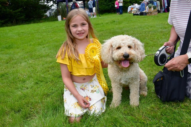 Ella Cattell, 9, with Baxter, who cane third in Most Handsome Dog category.