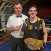 Reece Morris pictured with East Midlands official and belts organiser Ady Corssen