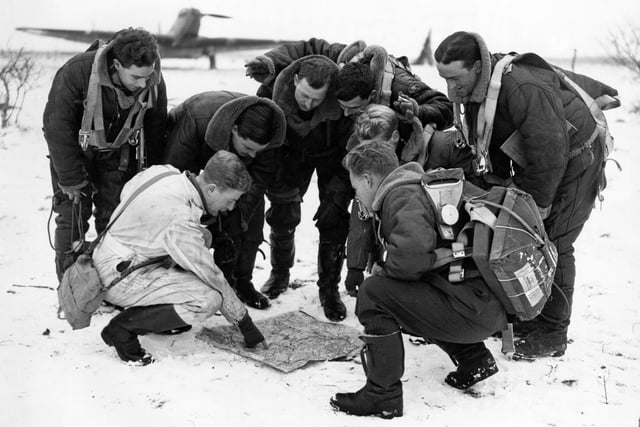 Fairey Battle crews of 12 Squadron check their maps on the snow-covered airfield at Amifontaine, France, 6 January 1940. Photo: RAF Air Historical Branch