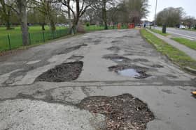 The potholed layby on Boston Road.