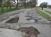 The potholed layby on Boston Road.