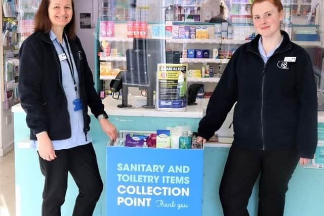 Lincolnshire Co-op colleagues Sharon Sylvester (left) and Abigail Walker with the hygiene bank donation point in the Spilsby Pharmacy branch.