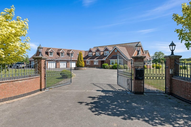 The gated, walled entrance to the property.