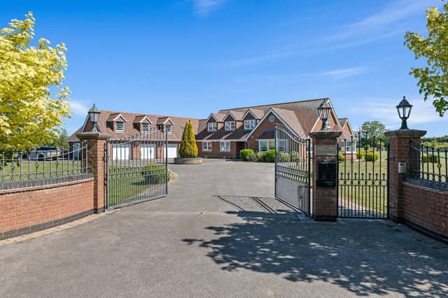 The gated, walled entrance to the property.