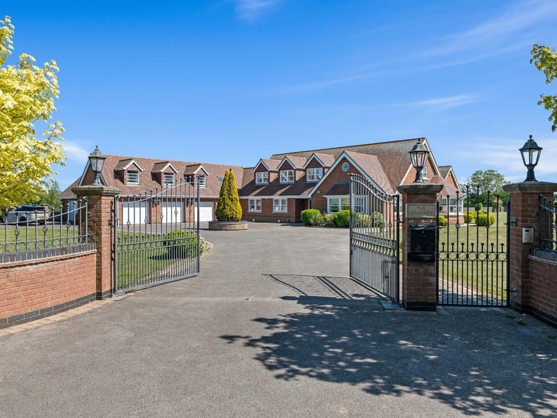 The gated, walled entrance to the property.