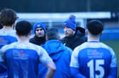 Manager Chris Funnell debriefs his squad on the pitch at full time!