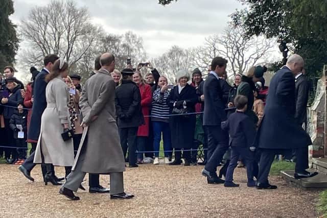 The Royal Family enters the church at Sandringham.