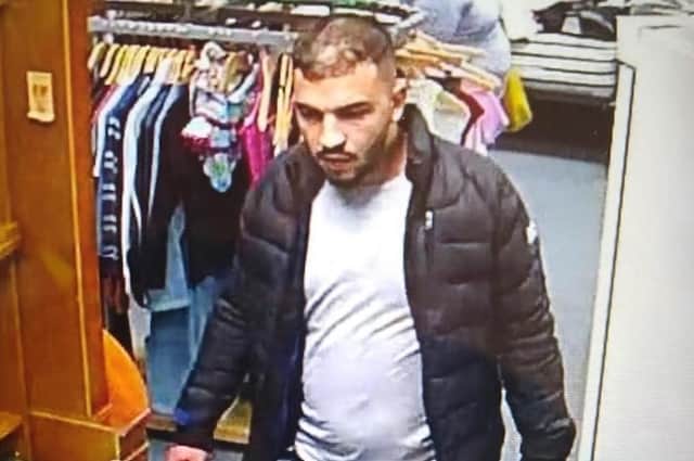 The image of the man police wish to speak to in connection with a theft in Boston.