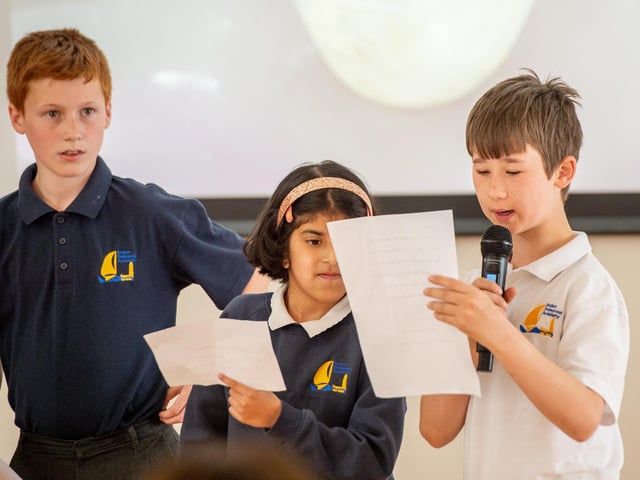 Children from Bubble bees Class read a poem and welcome the visitors