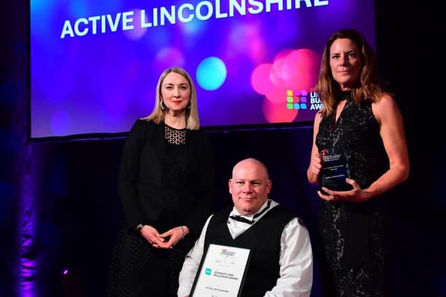 Natalie Fahy presenting the Diversity and Inclusion Award to Ian Brown and Emma Tatlow from Active Lincolnshire.
