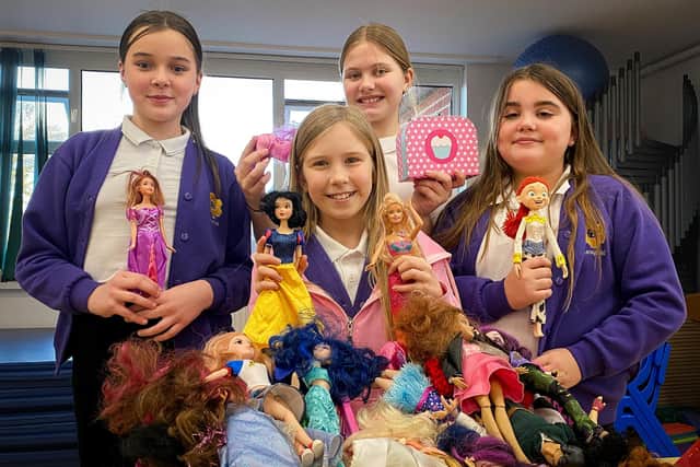 Pupils Martha, Mila, Jude and Lexie with a selection of Barbie Dolls. Photos: Chris Frear