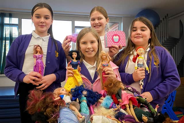 Pupils Martha, Mila, Jude and Lexie with a selection of Barbie Dolls. Photos: Chris Frear