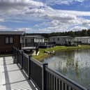 Holiday homes nestle around one of Watermill park's three tranquil fishing lakes in its extensive grounds