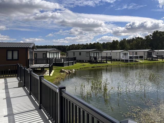 Holiday homes nestle around one of Watermill park's three tranquil fishing lakes in its extensive grounds