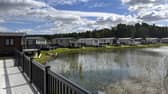 Holiday homes nestle around one of Watermill park's three tranquil fishing lakes in its extensive grounds