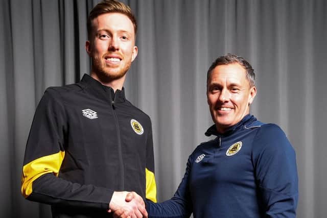 Louis Chadwick is welcomed by Boston boss Paul Hurst Pic by Chris Bray.