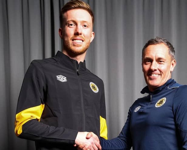 Louis Chadwick is welcomed by Boston boss Paul Hurst Pic by Chris Bray.