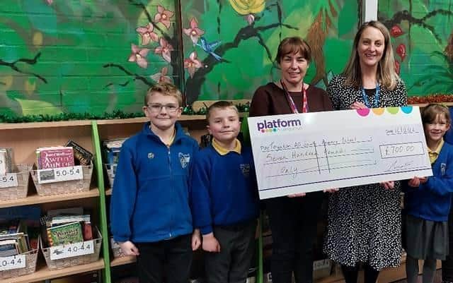 Platform’s Community Engagement Officer, Samantha Smith presenting the £700 Community Chest Fund donation to Toynton All Saints Primary School headteacher Suzy Sutton and pupils.