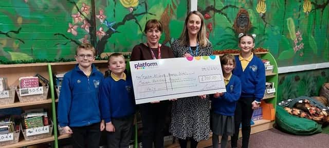 Platform’s Community Engagement Officer, Samantha Smith presenting the £700 Community Chest Fund donation to Toynton All Saints Primary School headteacher Suzy Sutton and pupils.