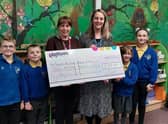 Platform’s Community Engagement Officer, Samantha Smith presenting the £700 Community Chest Fund donation to Toynton All Saints Primary School headteacher Suzy Sutton and pupils.